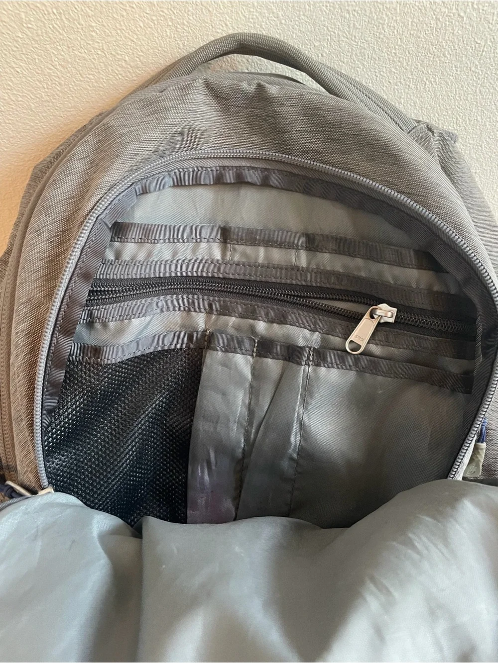 The North Face Gray Backpack with Blue Bungee Cord